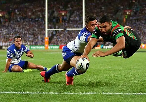 Rugby: Alex Johnston dei Rabbitohs realizza durante il 2014 NRL Grand Final tra South Sydney e Canterbury Bulldogs.